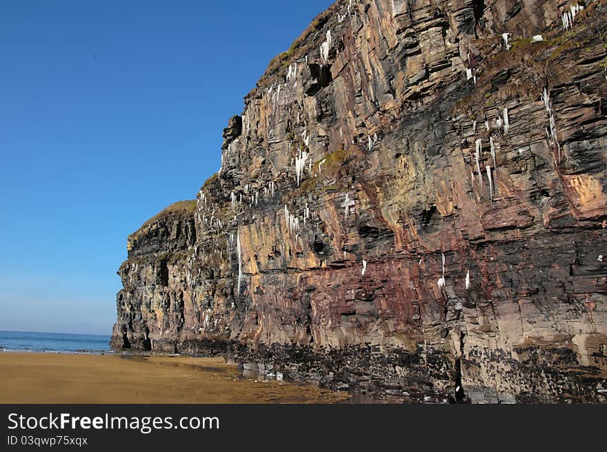 Icicles on a cliff face on ballybunion beach in ireland on a winters morning. Icicles on a cliff face on ballybunion beach in ireland on a winters morning