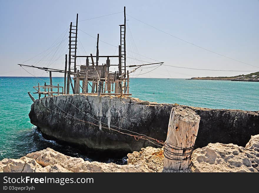 Trabucco is an old fishing machine typical of the coast of Gargano in the Apulia region of southeast Italy. It is protected as historical monument. Trabucco is an old fishing machine typical of the coast of Gargano in the Apulia region of southeast Italy. It is protected as historical monument.