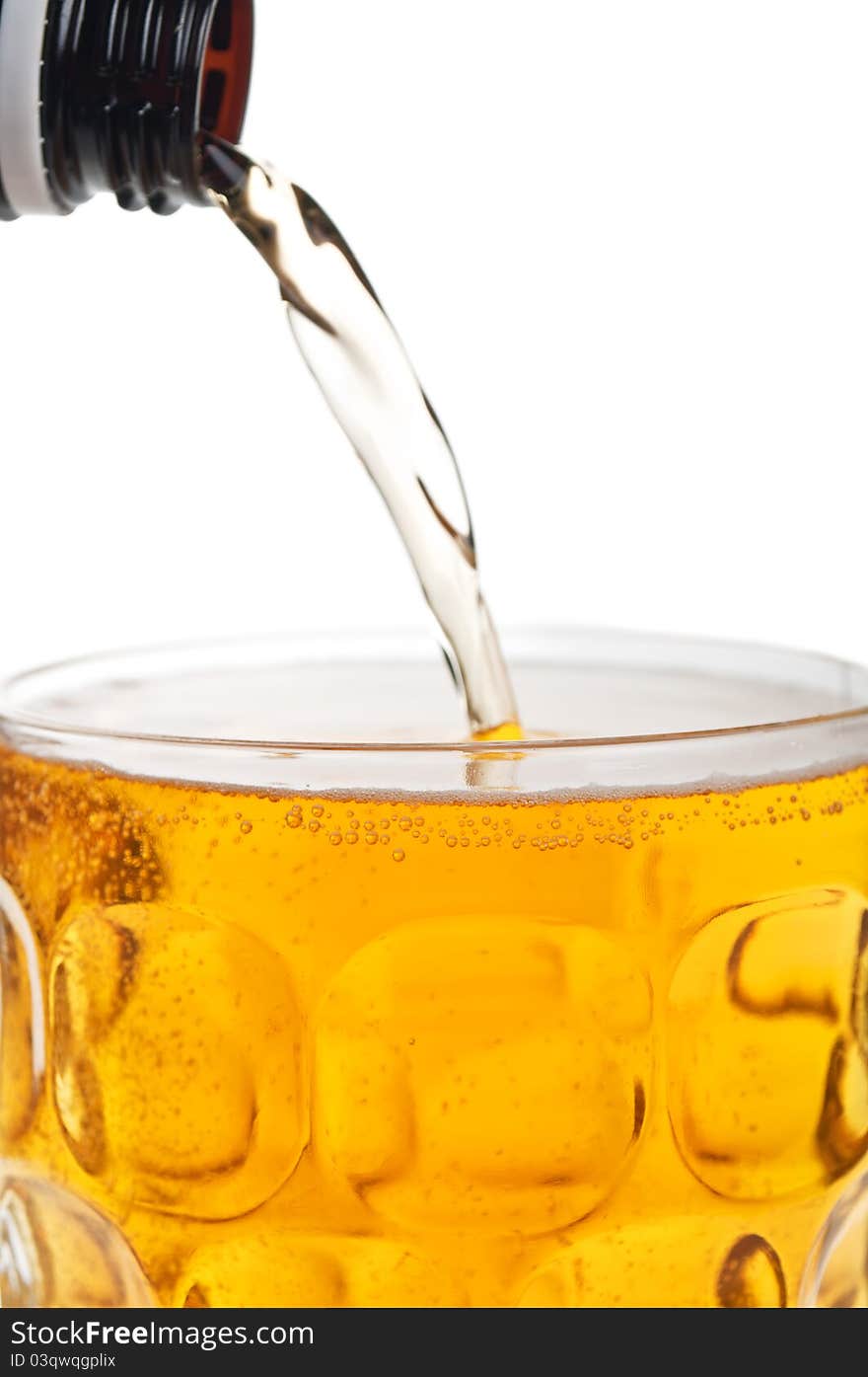 Fresh glass of beer isolated on a white background