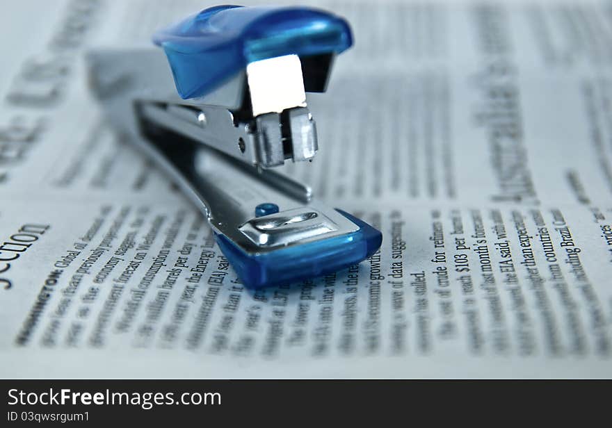 Stapler on Newspaper