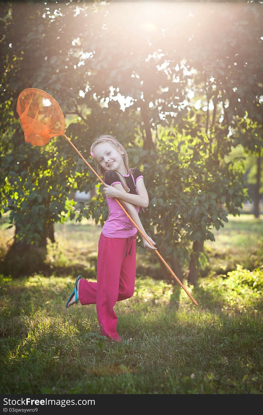 Smiling girl with butterfly net. Smiling girl with butterfly net