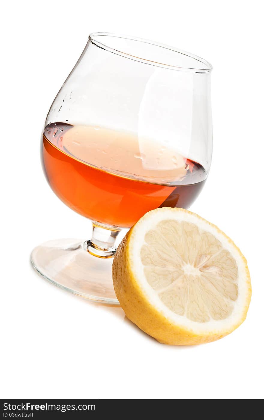 Whiskey and lemon isolated on a white background