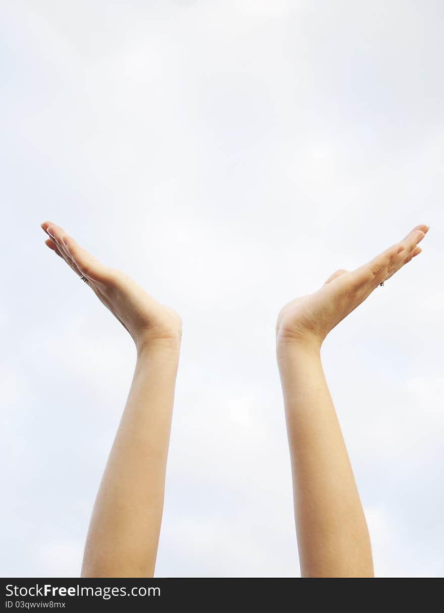 Empty woman hands up in the sky