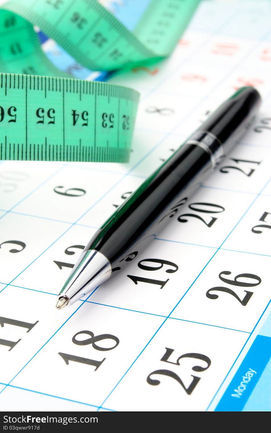 Calendar, a calculator and a pen close-up. Calendar, a calculator and a pen close-up