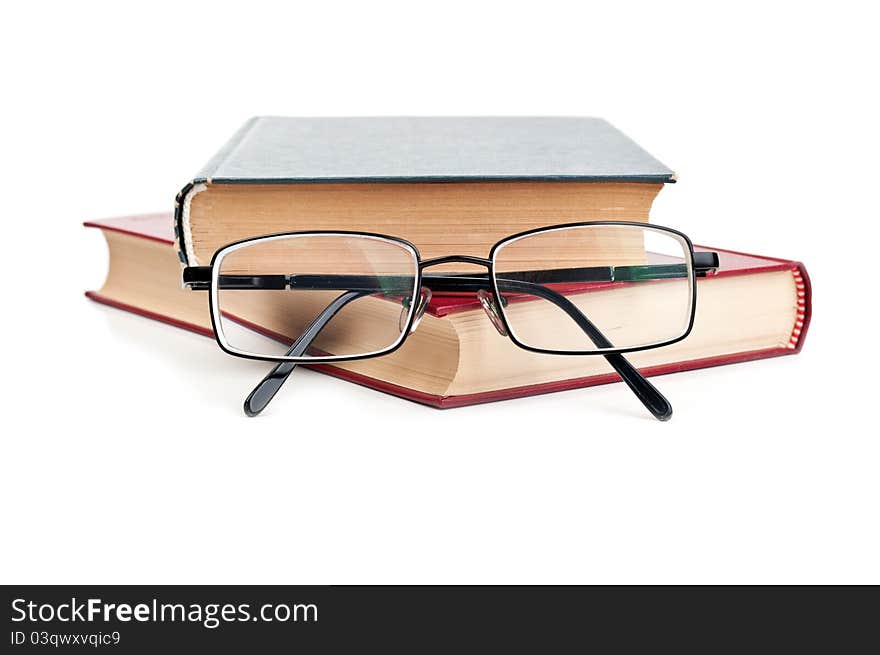 Glasses and red book isolated on a white background