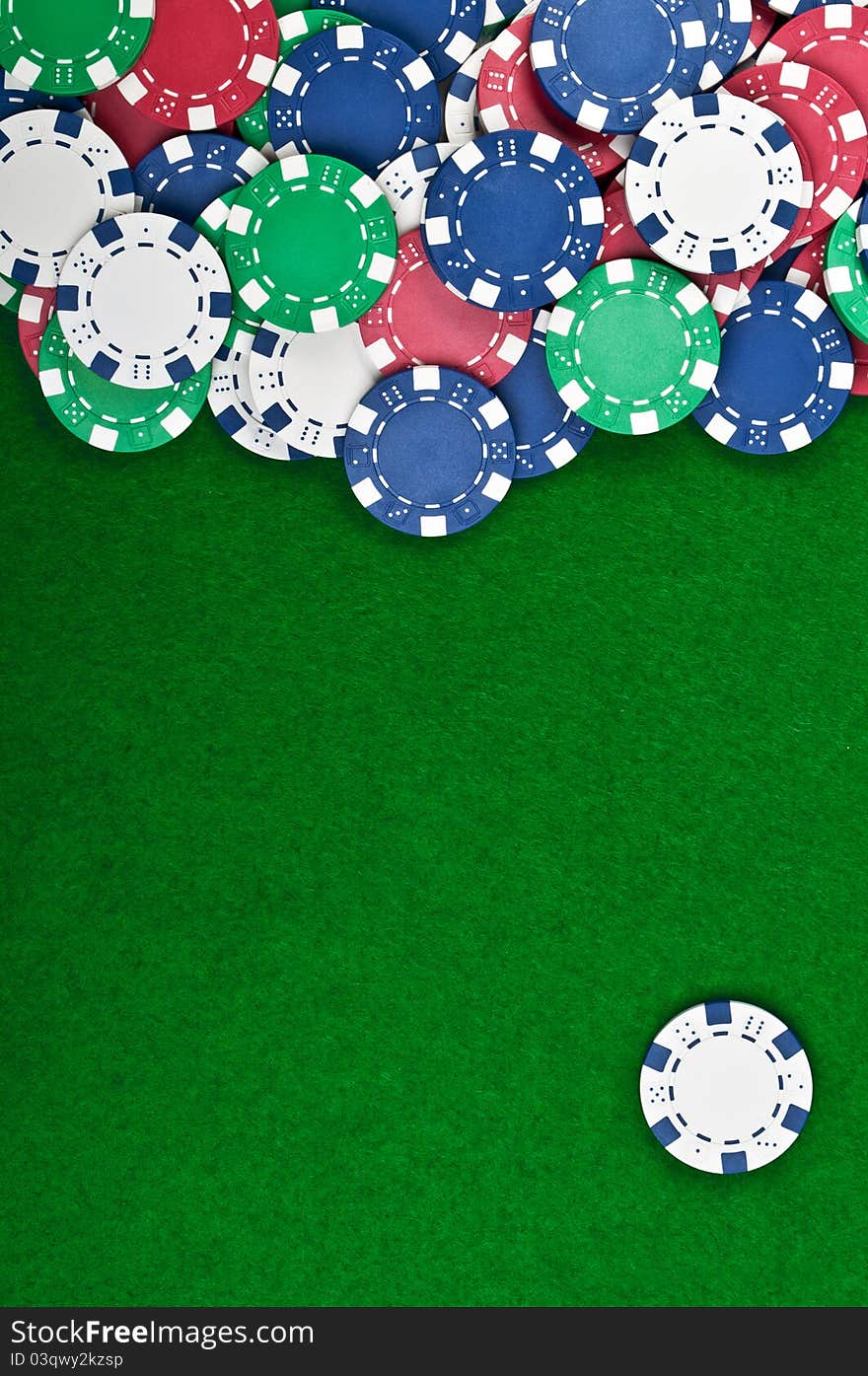 Poker chips on a green table background. Poker chips on a green table background