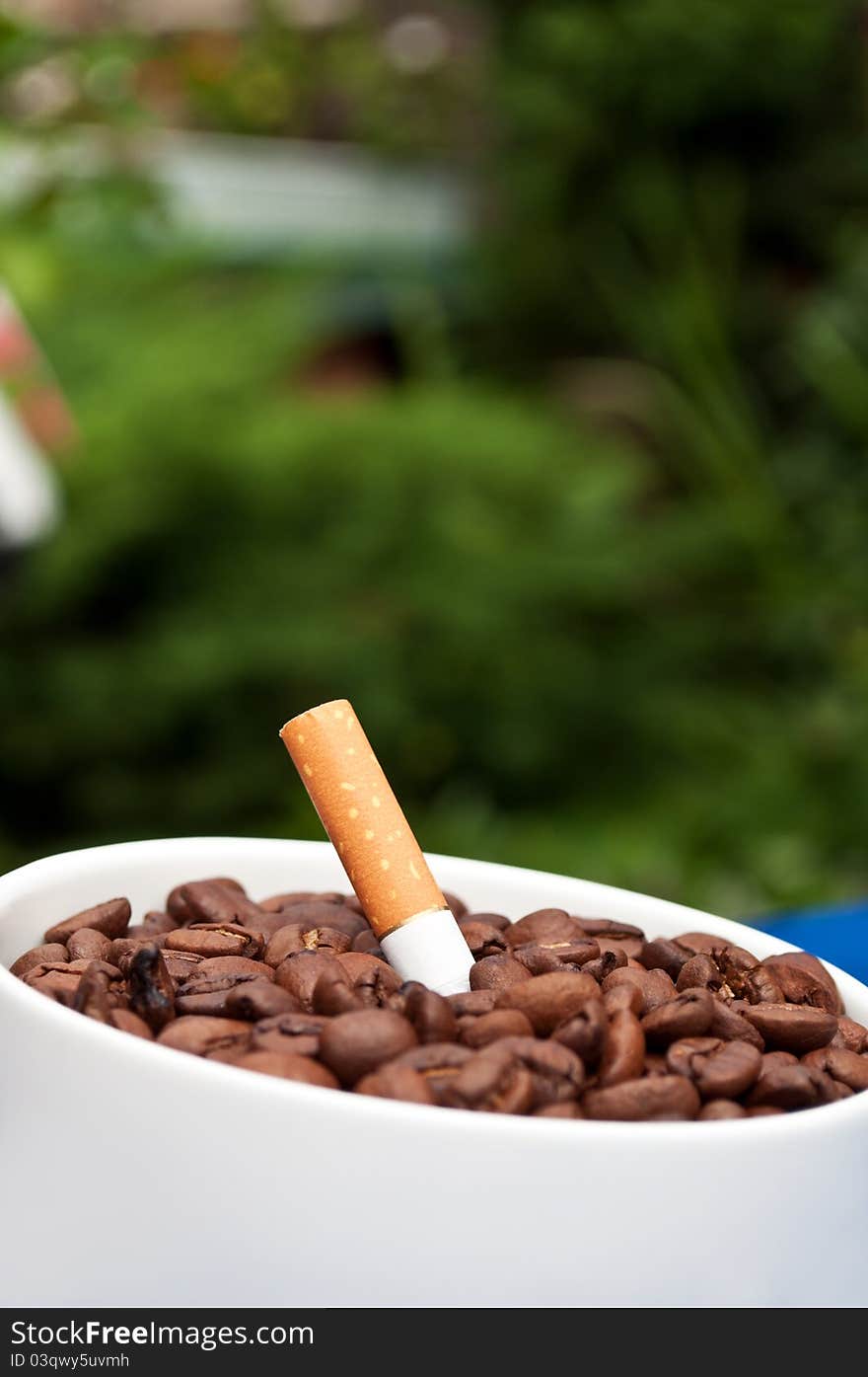 Coffee drink and cigarettes on a table in the street