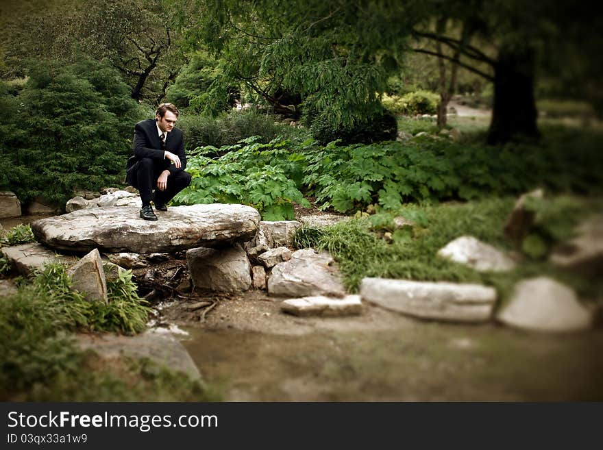 Man looking into creek