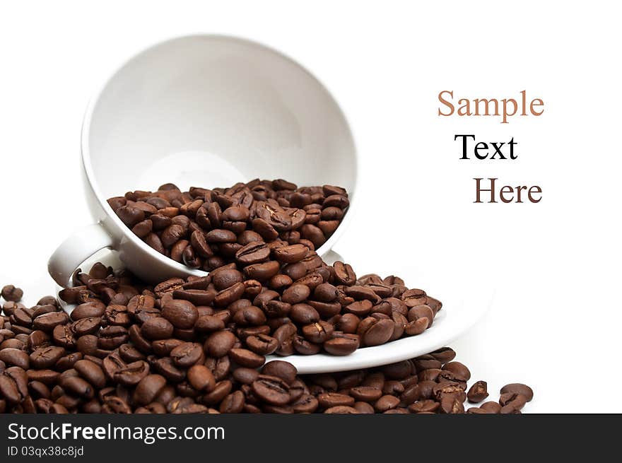 Full cup with coffee beans isolated on a white background