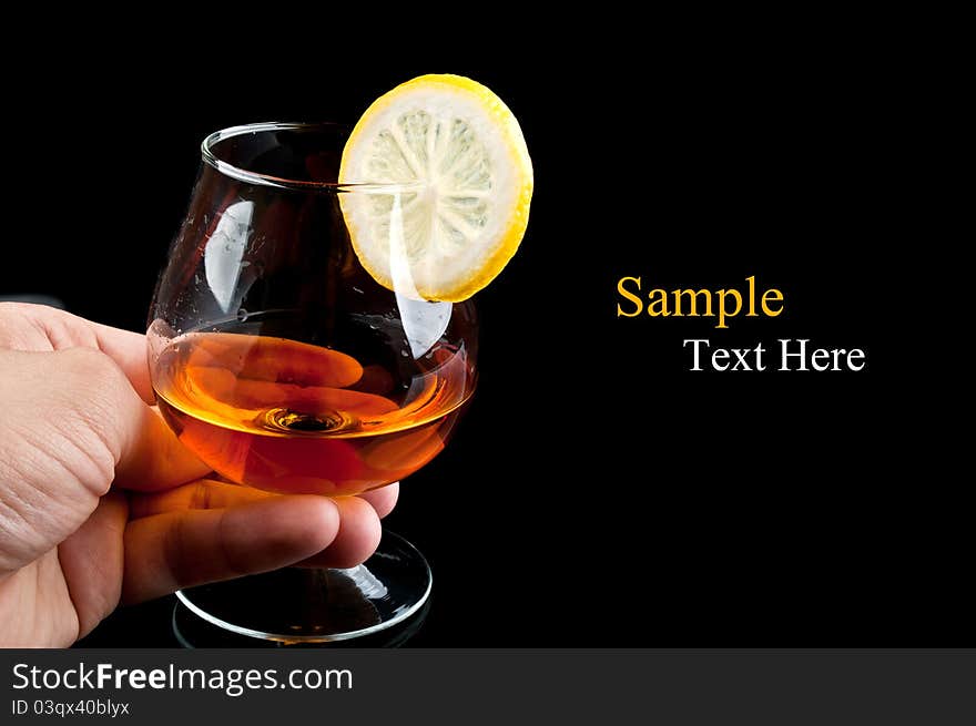 Cognac With Lemon In Hand