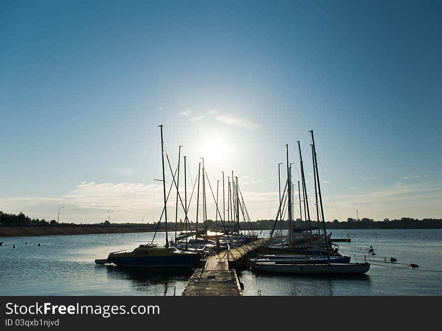 Yachts on an anchor in harbor, boats series