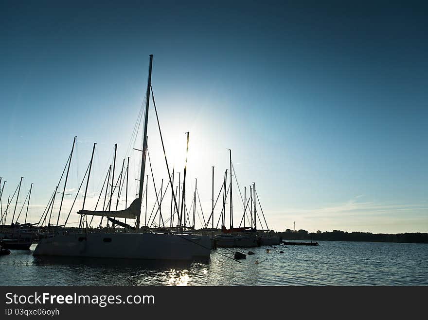 Yachts on an anchor in harbor, boats series