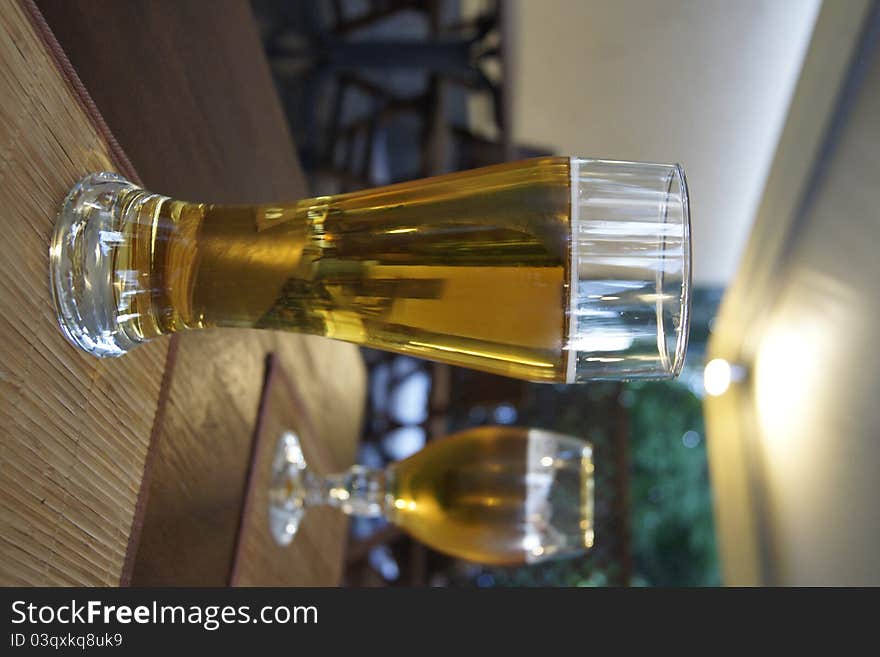 Two glasses of beer on the table in a restaurant. Two glasses of beer on the table in a restaurant