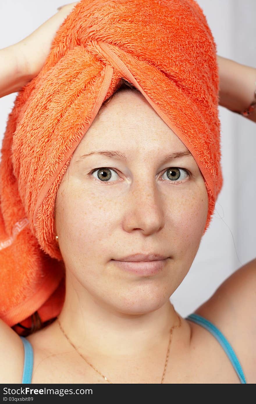 Woman after a shower with a towel on his head