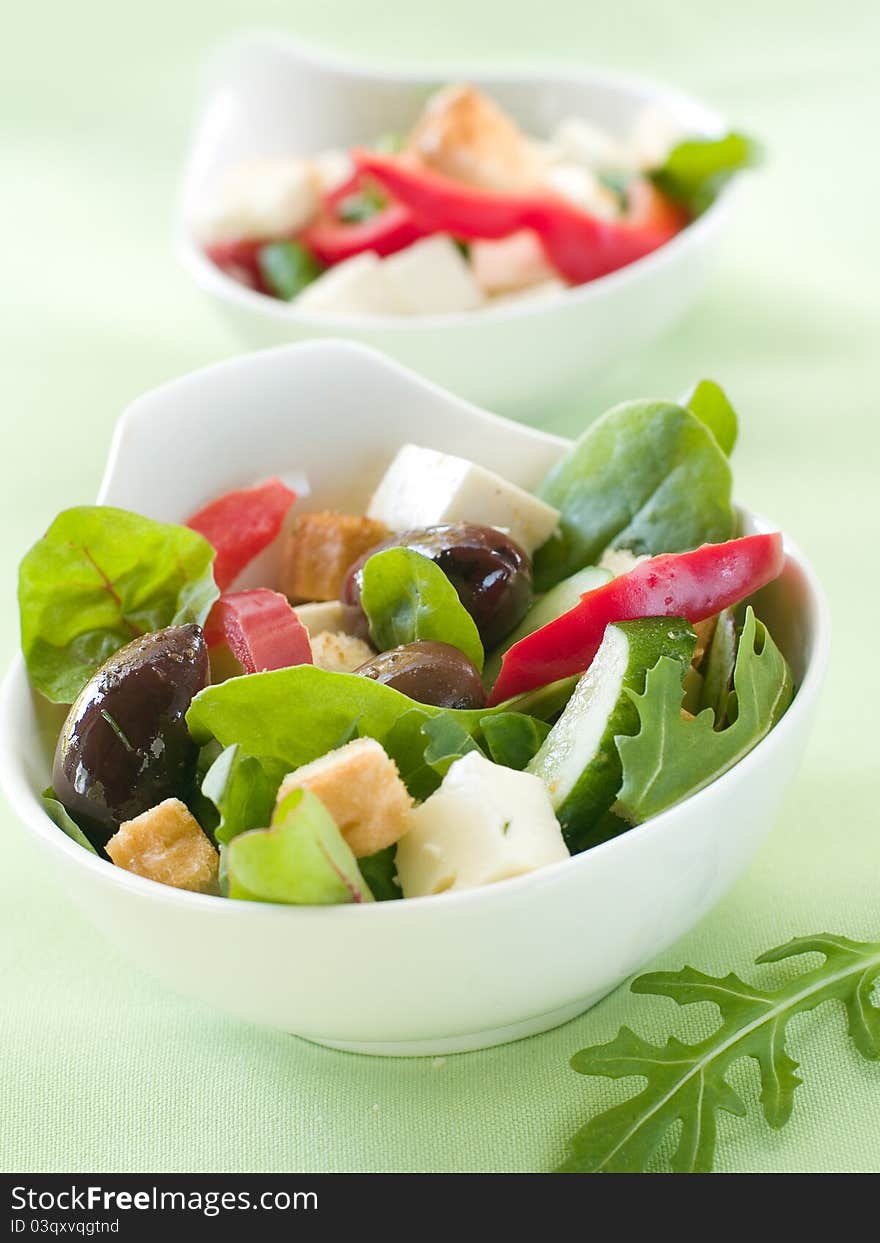 Fresh vegetable salad with calamata olives, crouton and cheese. Selective focus