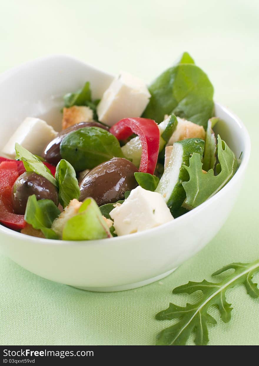 Fresh vegetable salad with calamata olives, crouton and cheese. Selective focus