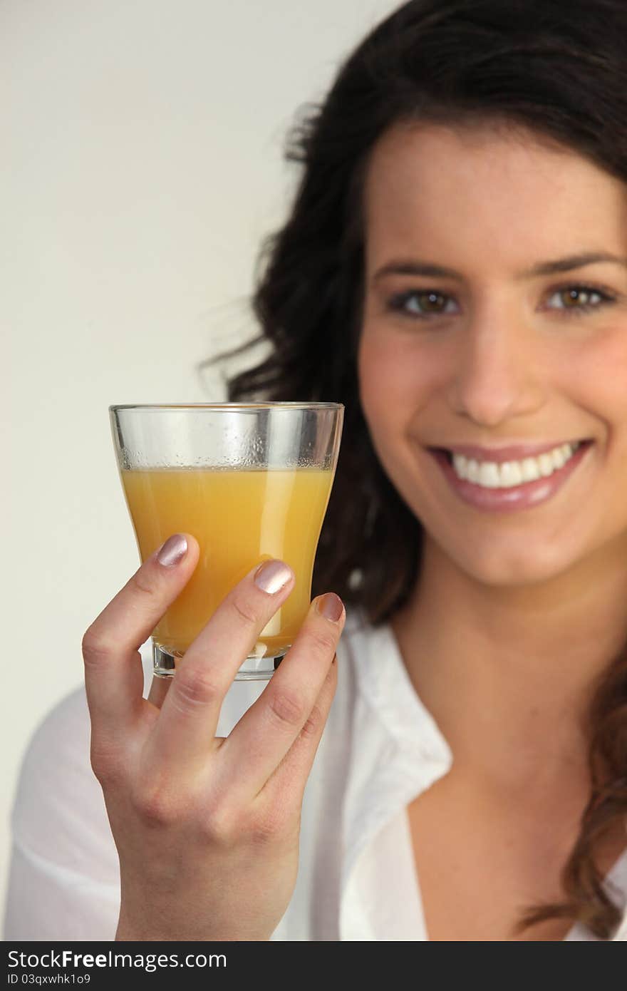 Woman Holding A Glass Of Orange Juice