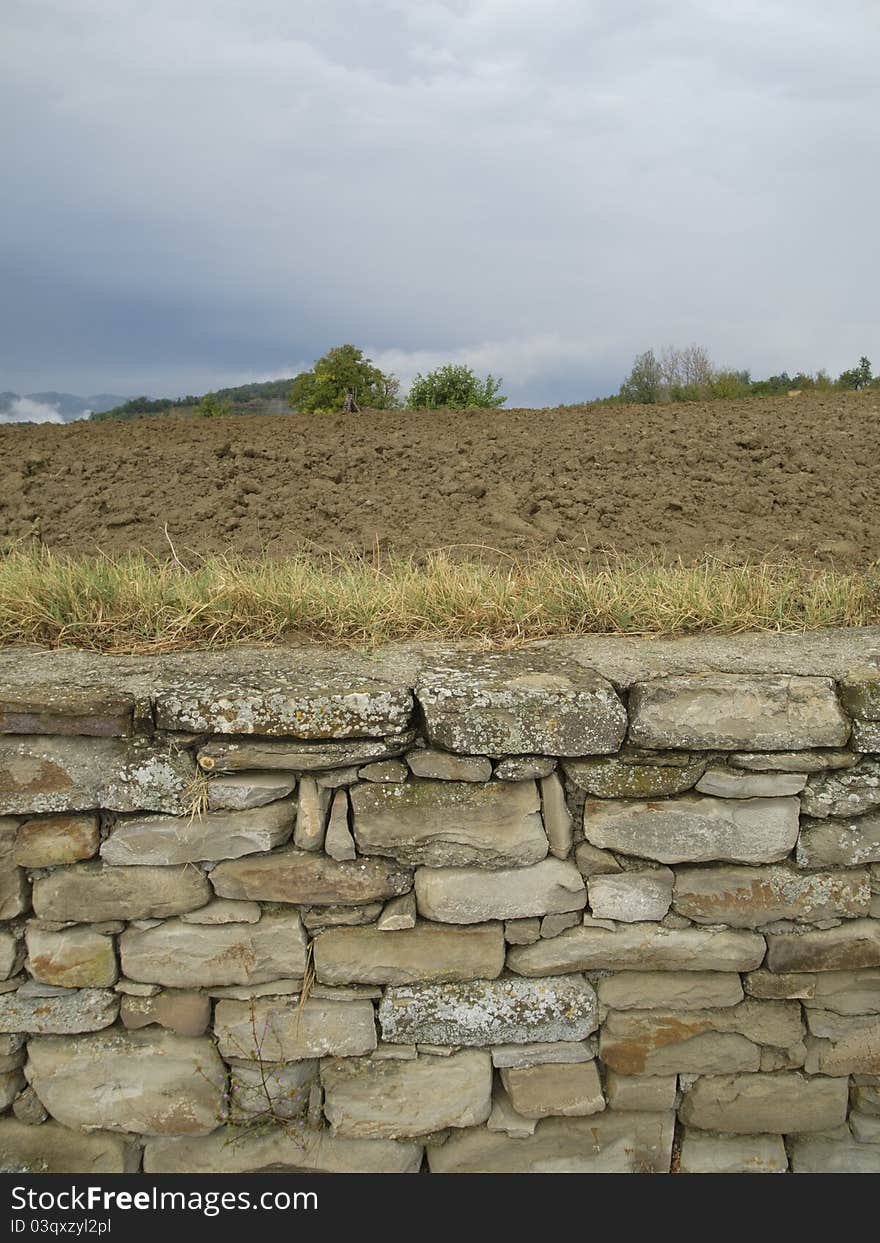 Landscape with old stone wall