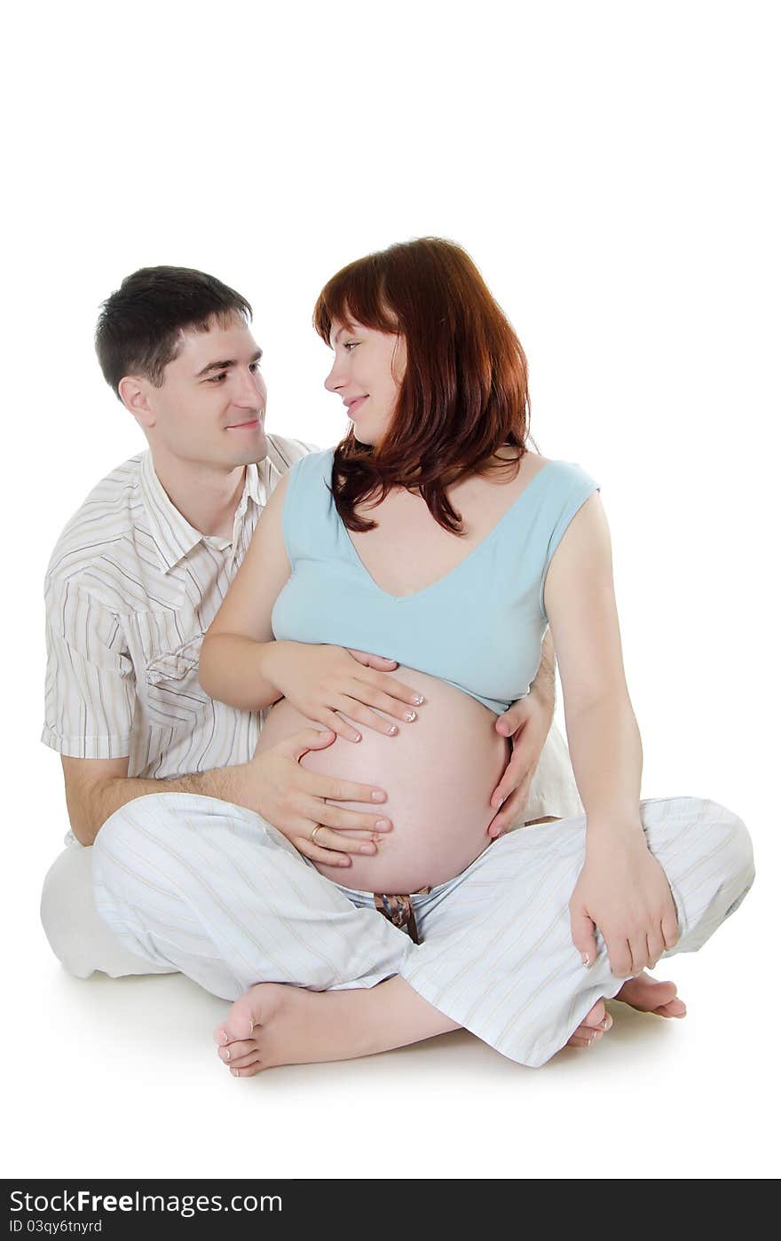 Happy pregnant couple on white background