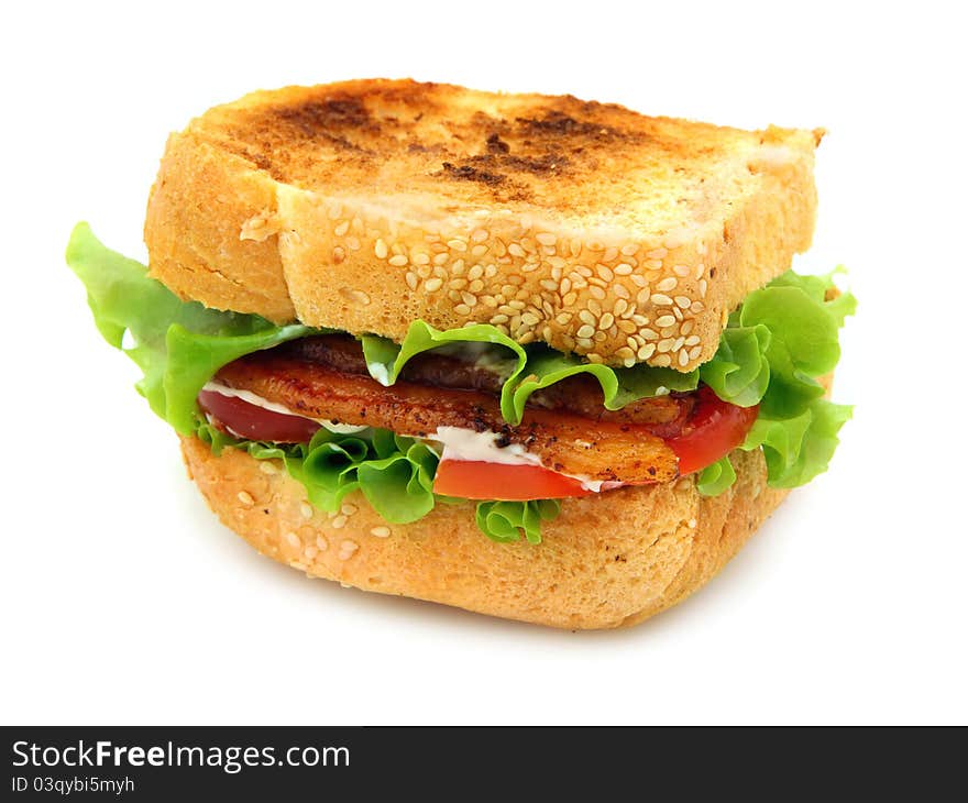 Bacon, Lettuce and Tomato sandwich on lightly toasted thickly sliced homemade bread. Isolated on white background.