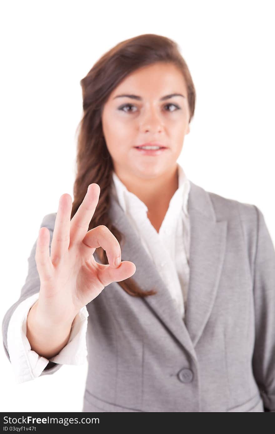 Business woman signalling ok, selective focus on hand