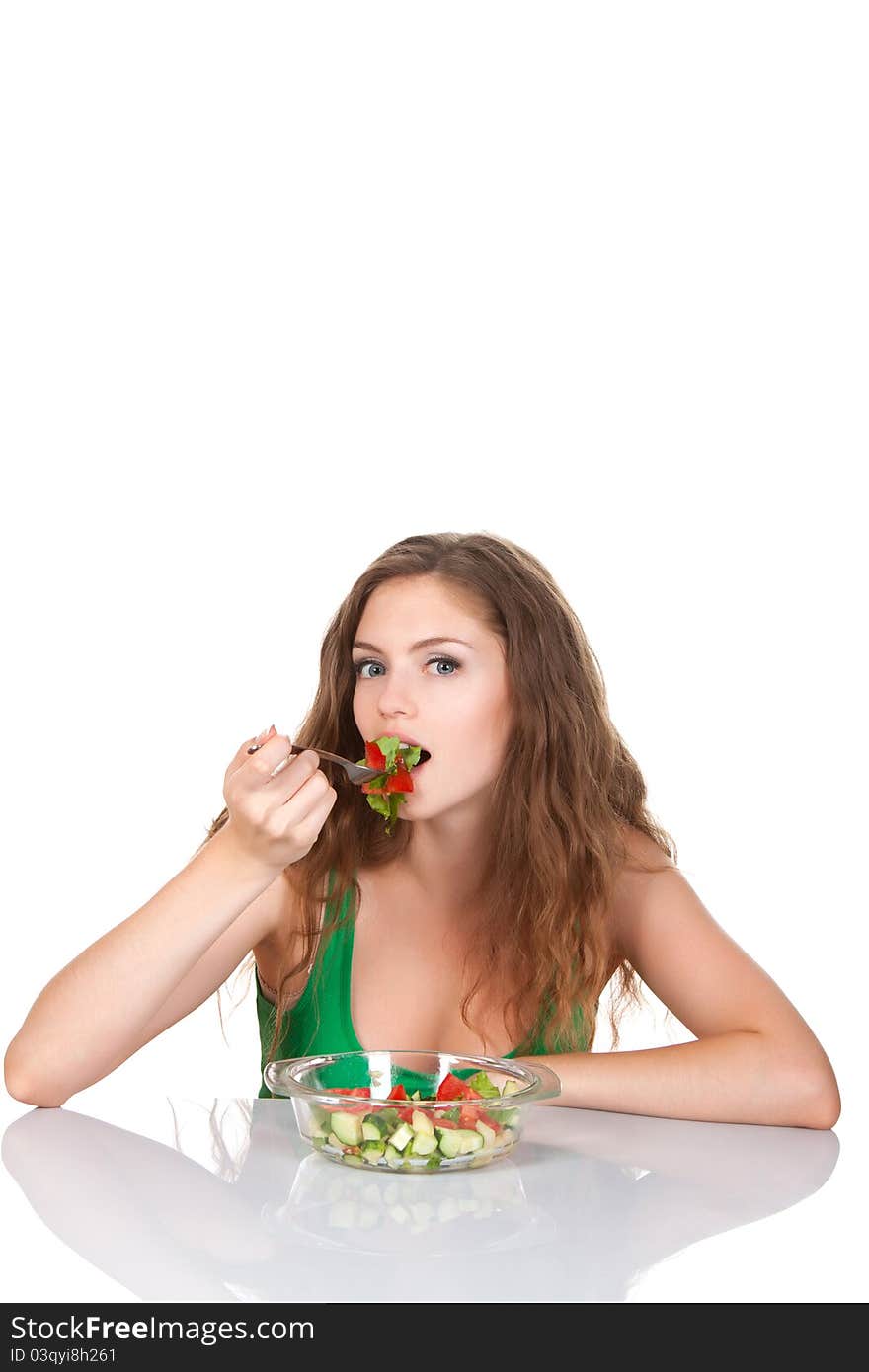 Portrait of attractive young smile woman eating vegetable salad. Portrait of attractive young smile woman eating vegetable salad