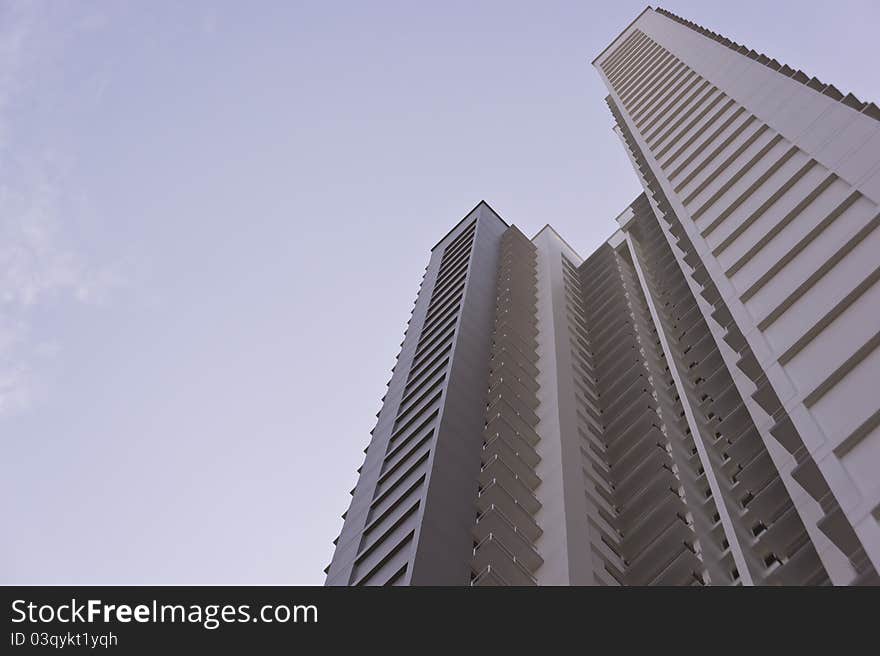 Big grey apartment building in residential settlement