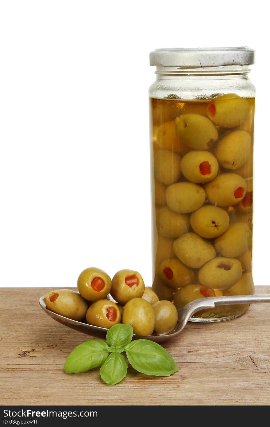 Jar of olives and spoon