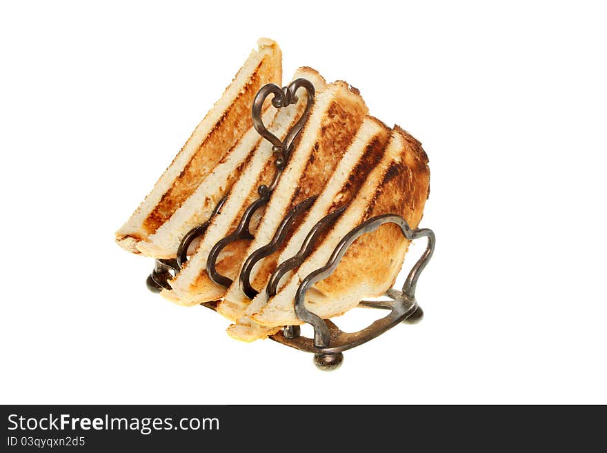 Toast in a toast rack isolated against white