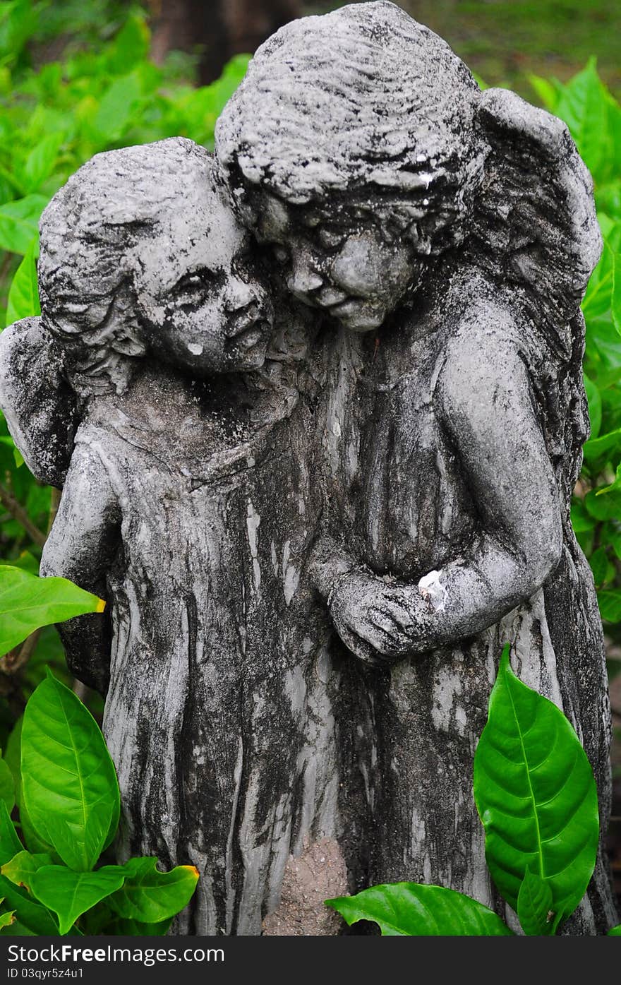 Two Cupid Sculpture in garden