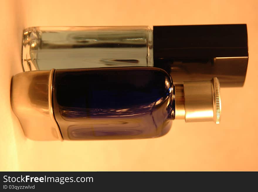 Two masculing looking perfume bottles. Two masculing looking perfume bottles