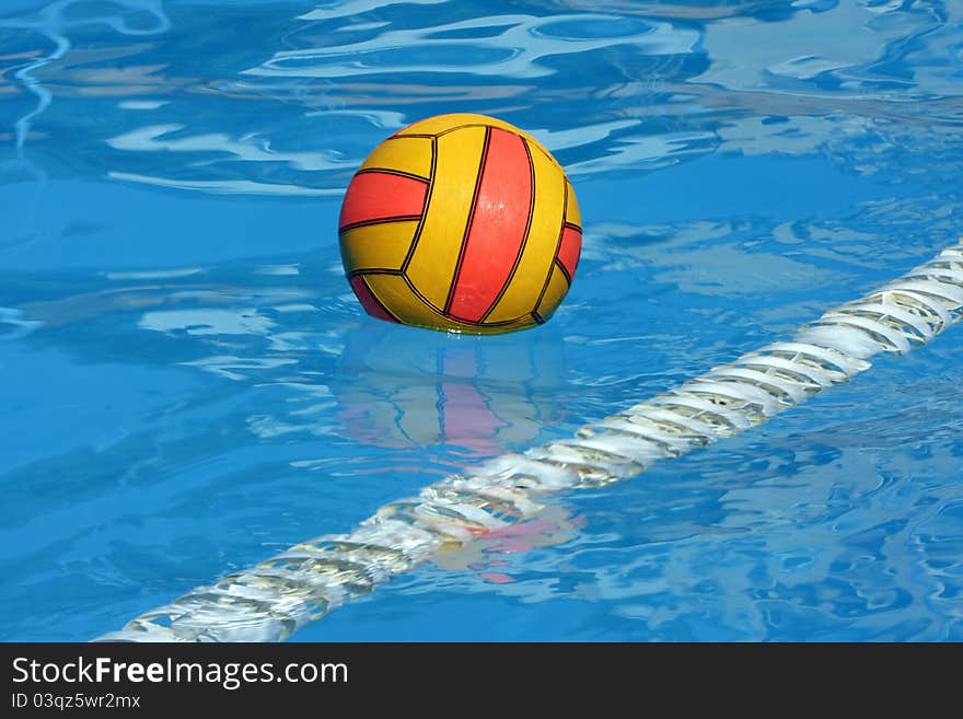 Water polo ball in a swimming pool. Water polo ball in a swimming pool