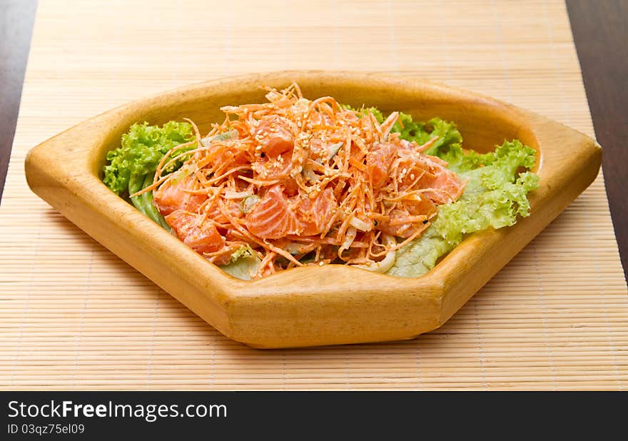 Salad with sashimi of salmon, carrots and sesame seeds. Salad with sashimi of salmon, carrots and sesame seeds