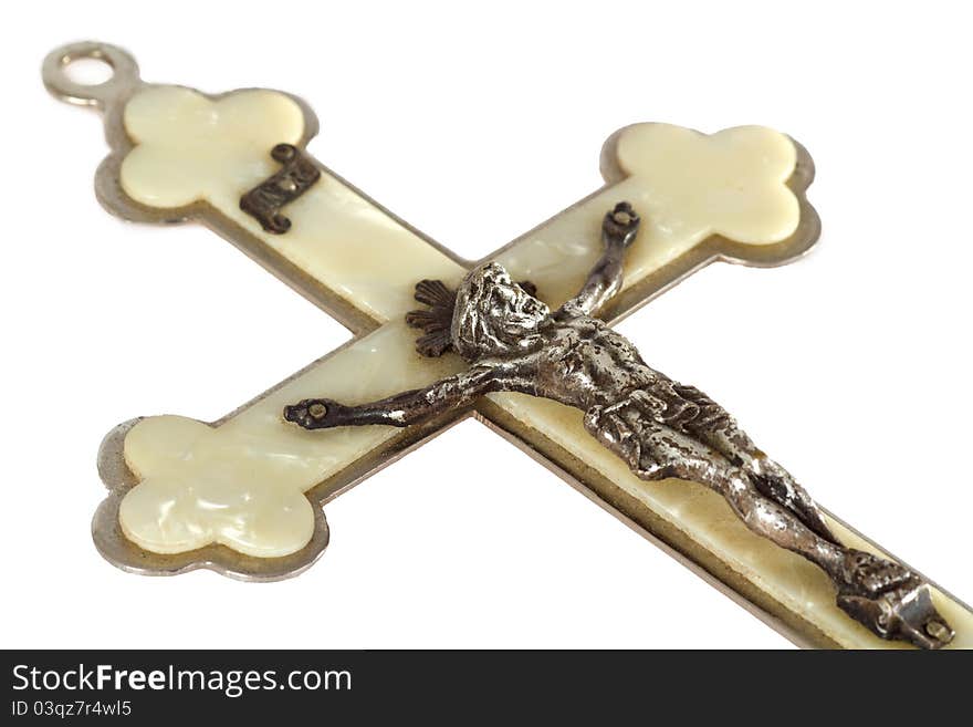 Pearly crucifix isolated on white background