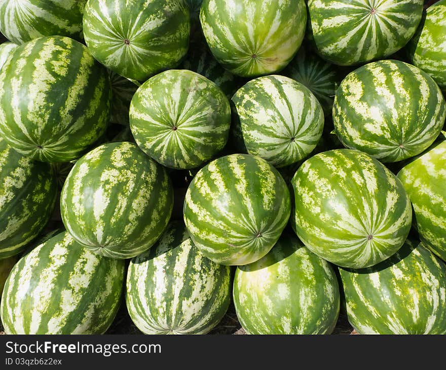 Watermelons arranged on street market. RAW format present. Watermelons arranged on street market. RAW format present