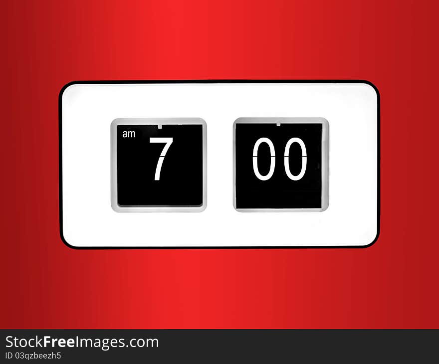 A flip clock  against a red background