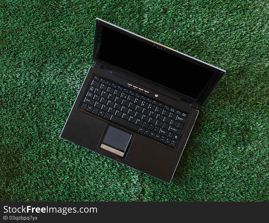 A laptop computer on a work desk