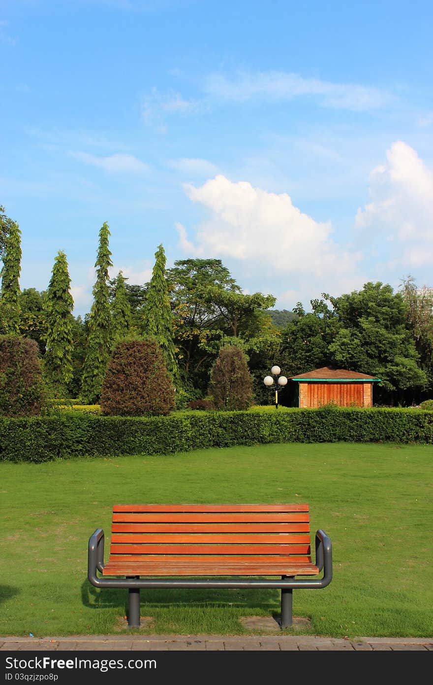 Sunset wooden park bench looks beautiful