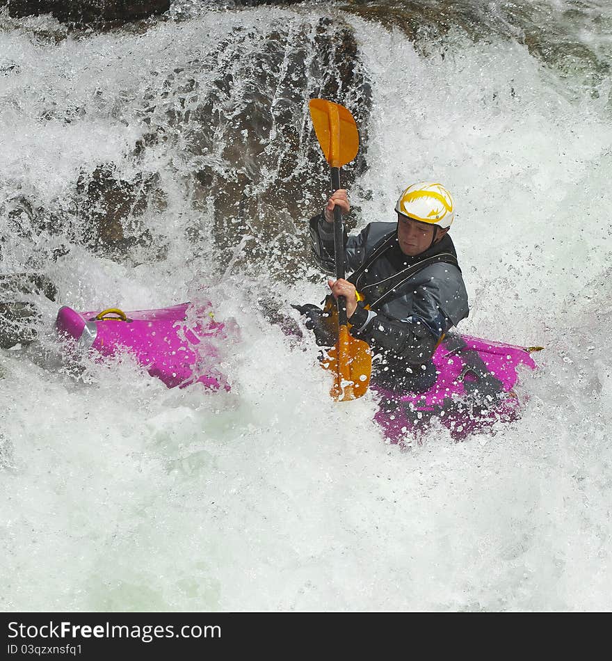 Kayaker in the waterfall