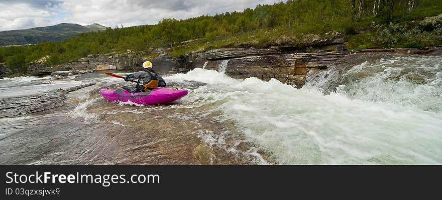 Kayaker In The Waterfall