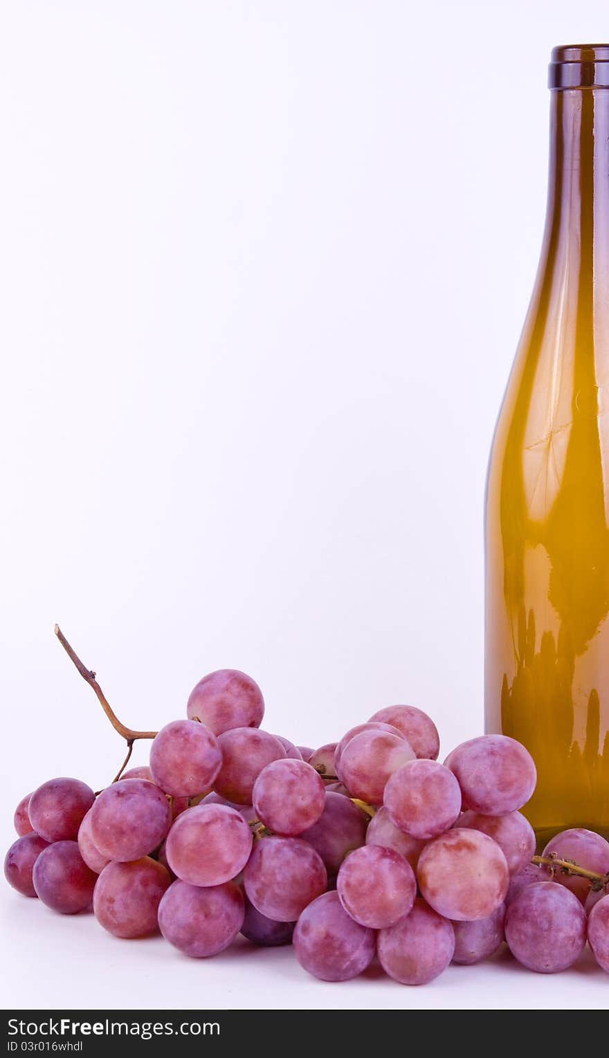 Grapes With Bottle On White