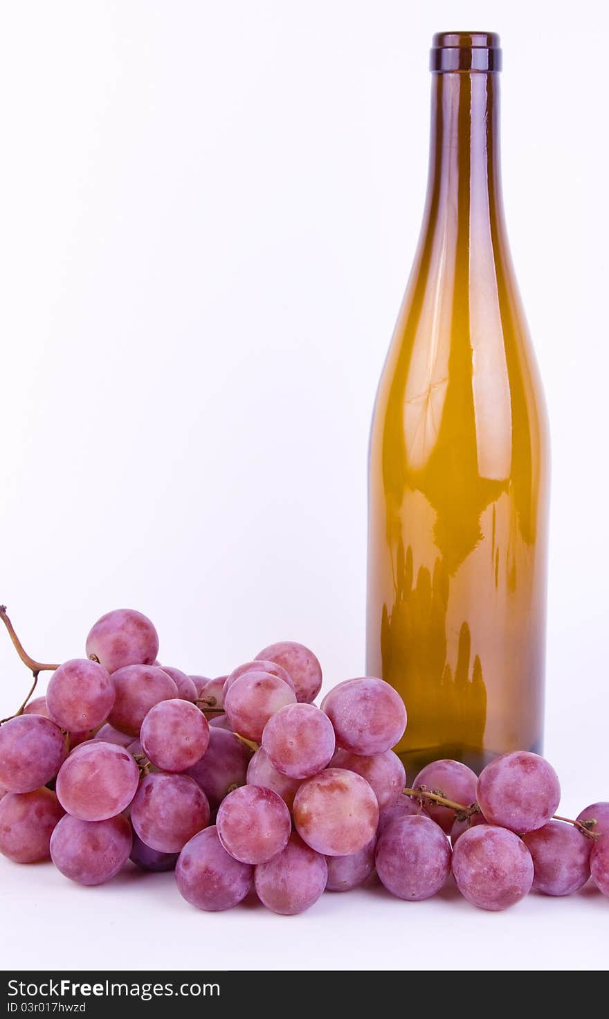 Grapes With Bottle On White