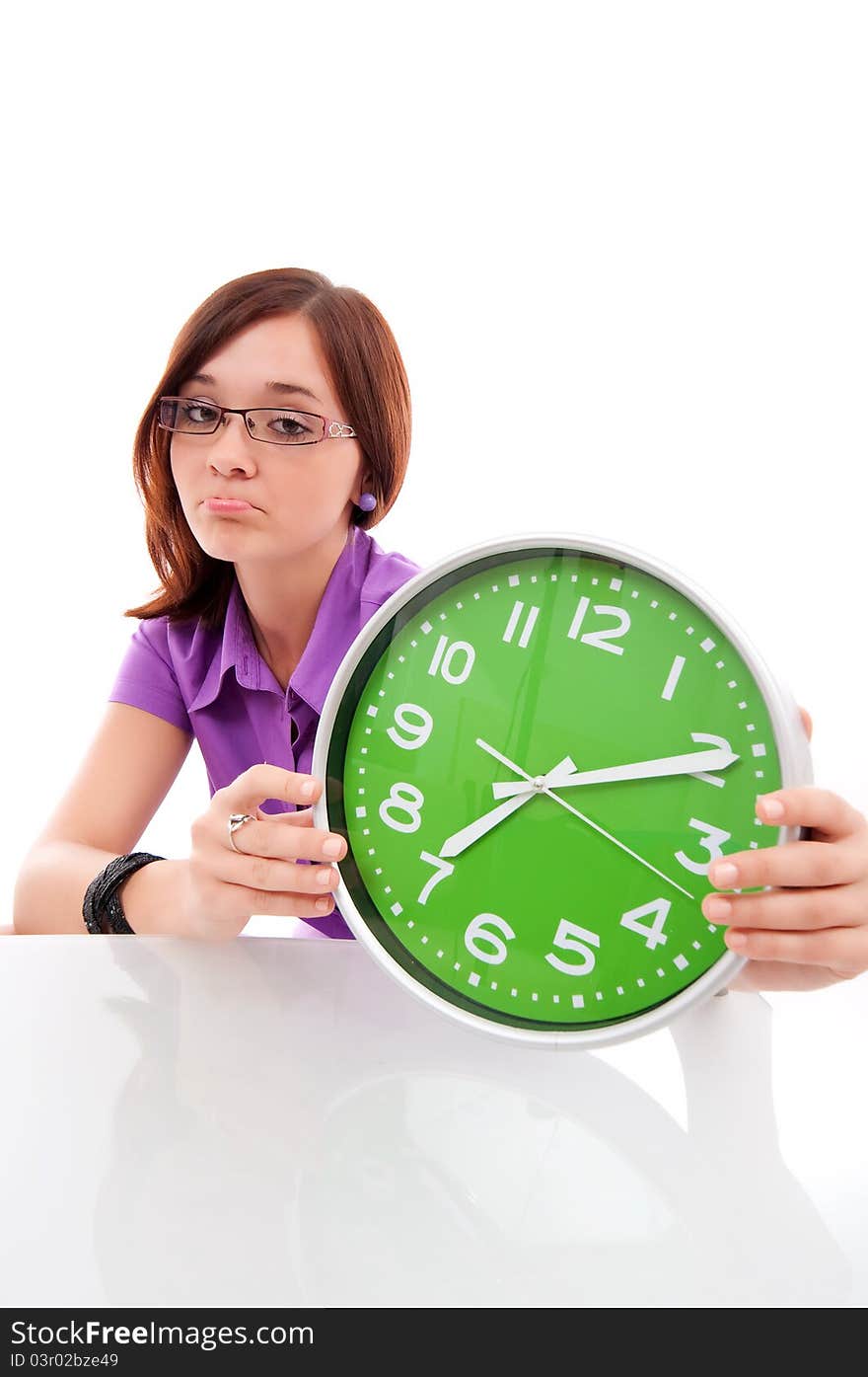 Woman holding big green clock