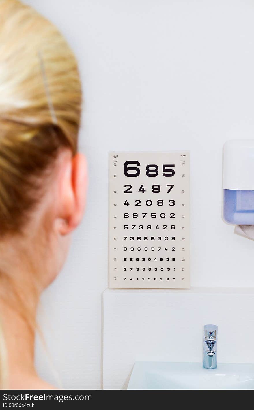 Doctor testing her patient's eyesight. Doctor testing her patient's eyesight