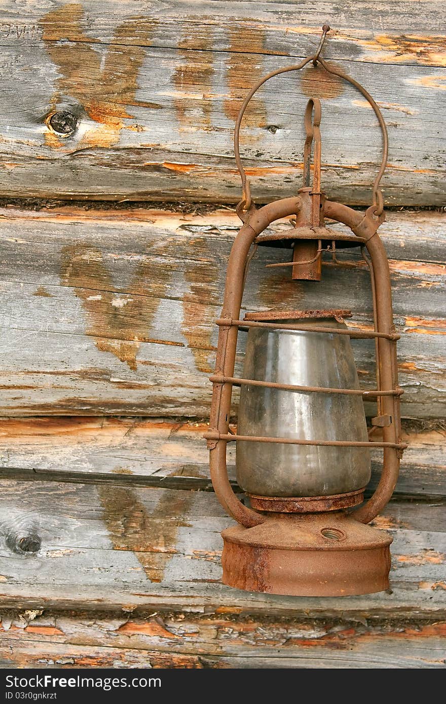 The old kerosene lamp hanging on the wall of a village house