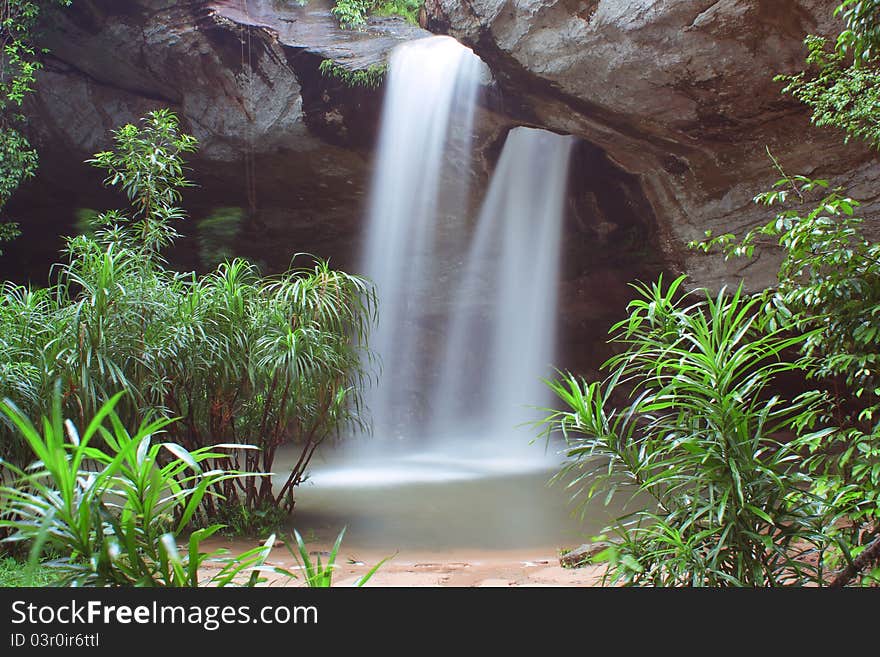 Two waterfalls flow into a large hole in a cool spirit.