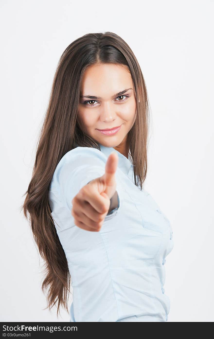 Casual woman smiling with her thumbs up -