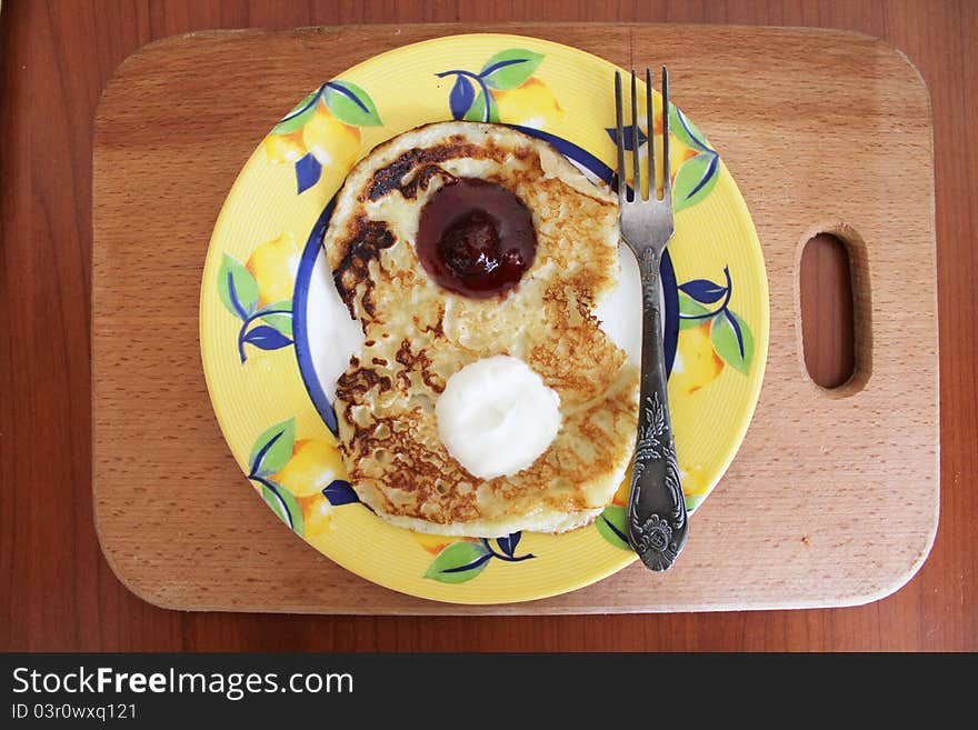 Pancakes with sour cream and jam on March 8