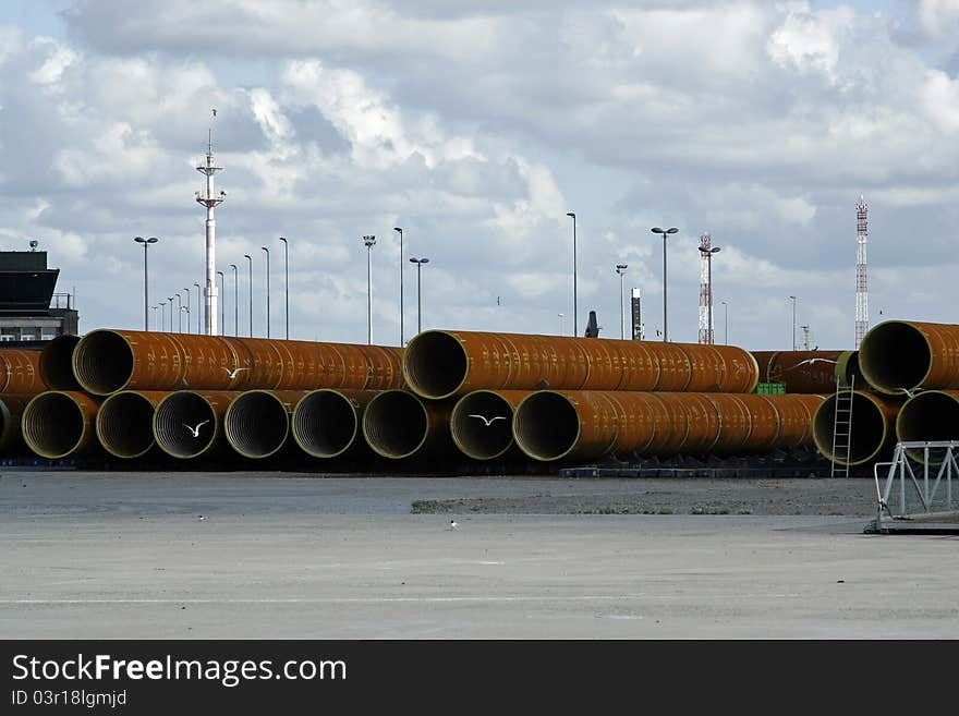 Large pipes ready to be transported, and playground for gulls. Large pipes ready to be transported, and playground for gulls