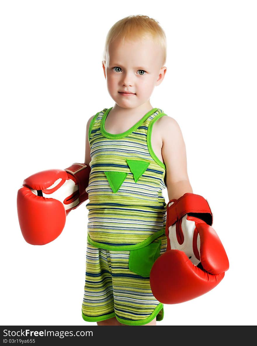 Little boy in red boxing gloves on white background